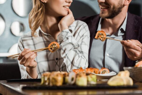 cropped-view-of-smiling-happy-couple-eating-sushi-FLDVR2F-1024x683